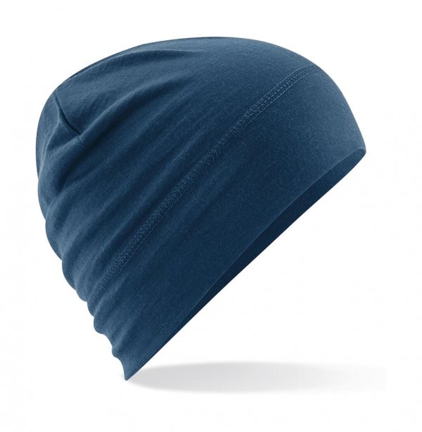 Kepurė iš 100 % merino vilnos su dvisluoksniu atvartu – šilta ir švelni odai.